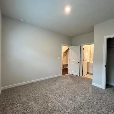 Rent this 4 bed townhouse on Appalachian Alley in Charlotte, NC 28217