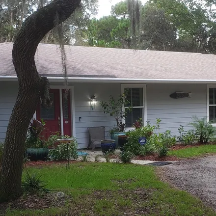 Buy this 4 bed house on 5991 Trailwood Drive in Port Orange, FL 32127