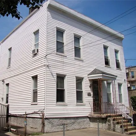 Buy this 8 bed house on 18-12 124th Street in New York, NY 11356