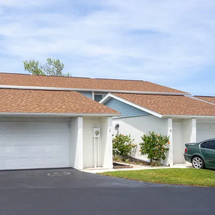 Buy this 2 bed townhouse on 2 Chippingwood Lane in Ellinor Village, Ormond Beach