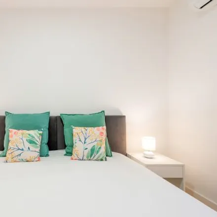 Rent this 4 bed room on Giallo in Largo do Chafariz de Dentro 35, 1100-139 Lisbon