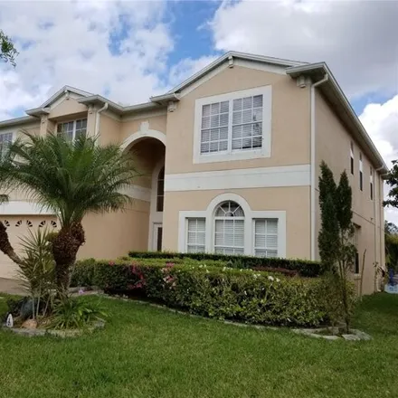 Rent this 5 bed house on 12714 Moss Park Ridge Drive in Orange County, FL 32832