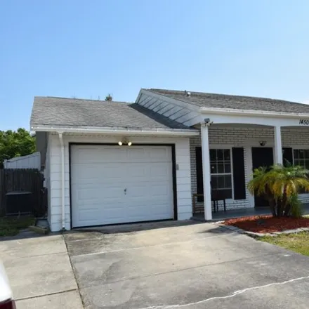 Rent this 3 bed house on 1444 Creel Road Northeast in Palm Bay, FL 32905