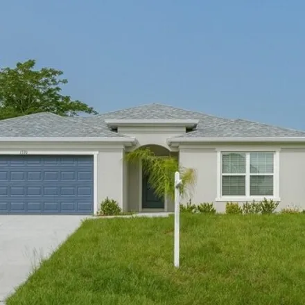 Buy this 4 bed house on 909 Brickell Street Southeast in Palm Bay, FL 32909