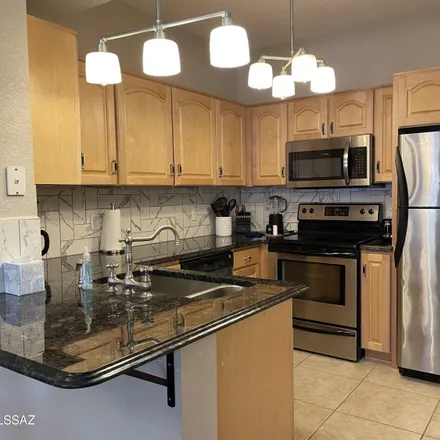 Rent this 3 bed condo on 1500 East Pusch Wilderness Drive in Oro Valley, AZ 85737