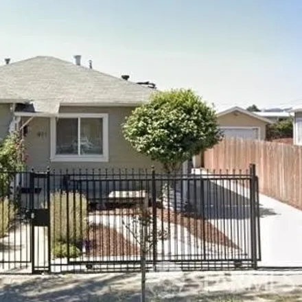 Rent this 3 bed house on 911 90th Avenue in Oakland, CA 94621