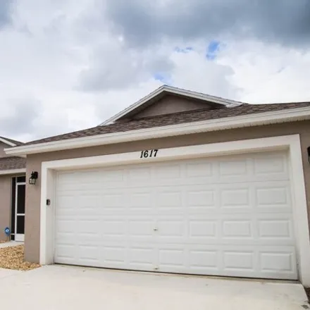 Buy this 4 bed house on 1623 Southwest Import Drive in Port Saint Lucie, FL 34953