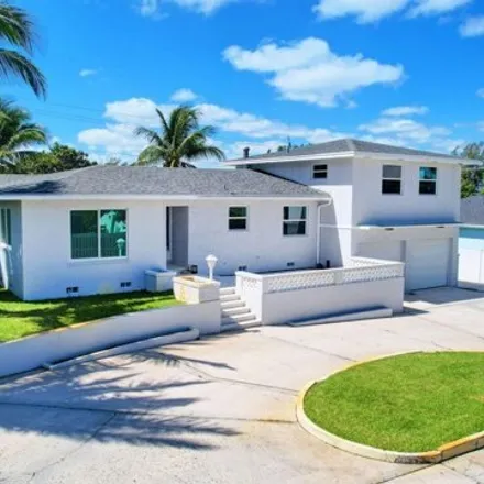 Buy this 4 bed house on 2147 Collier Avenue in Lake Worth Beach, FL 33461