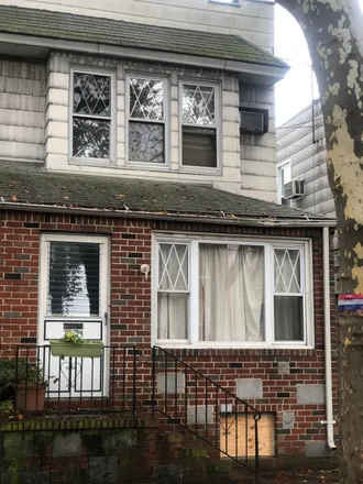 Buy this 3 bed house on 70-30 80th Street in New York, NY 11385