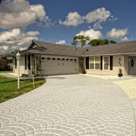 Buy this 3 bed house on 605 Northeast Horizon Lane in Port Saint Lucie, FL 34983