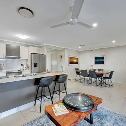 Rent this 4 bed apartment on Shoalmarra Drive in Mount Low QLD 4818, Australia
