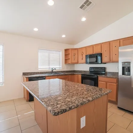 Rent this 4 bed apartment on 14105 North 133rd Drive in Surprise, AZ 85379
