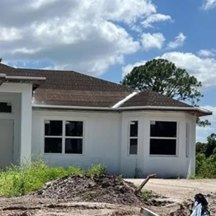 Buy this 3 bed house on 704 Chattman Street East in Lehigh Acres, FL 33974