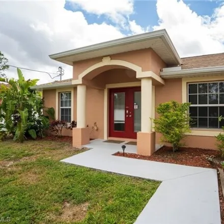 Rent this 4 bed house on 940 Belmont St E in Lehigh Acres, Florida