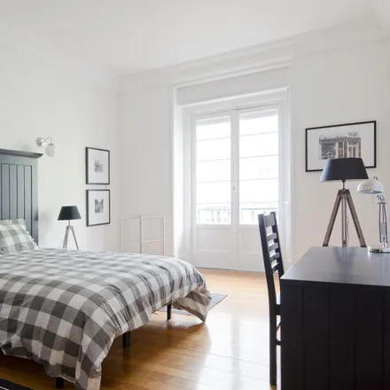 Rent this 6 bed room on Avenida Praia da Vitória 77 in 1050-120 Lisbon, Portugal