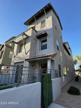Rent this 4 bed townhouse on Village of Spring Apartment in Chandler, AZ 85226