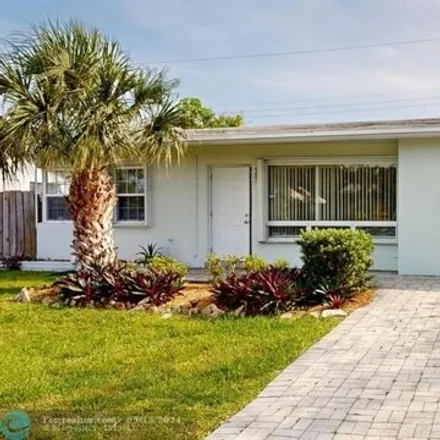 Rent this 3 bed house on 1624 Northeast 29th Street in Cresthaven, Pompano Beach