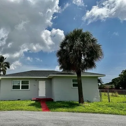 Rent this 3 bed house on 459 Silver Beach Rd in Lake Park, Florida