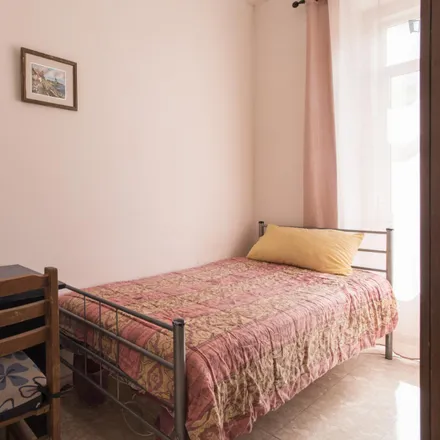 Rent this 7 bed room on Rua Ângela Pinto in 1900-287 Lisbon, Portugal