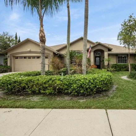 Buy this 4 bed house on Woods Walk Boulevard in Palm Beach County, FL 33449