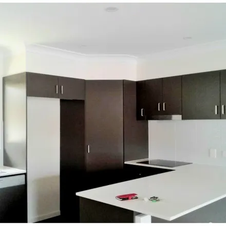 Rent this 3 bed townhouse on 15 Oasis Close in Manly West QLD 4179, Australia