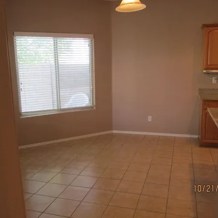 Rent this 4 bed apartment on 1126 East Canyon Trail in San Tan Valley, AZ 85143