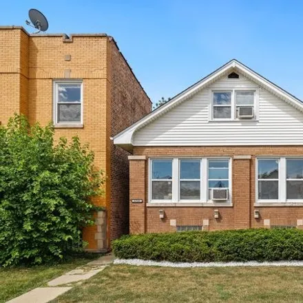 Buy this 4 bed house on Beat 2513 in 1702-1704 North McVicker Avenue, Chicago