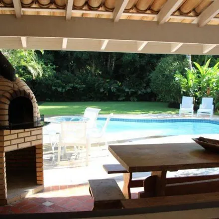 Rent this 5 bed house on Alameda Agogô in Riviera, Bertioga - SP