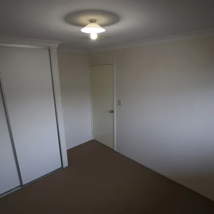 Rent this 4 bed apartment on The Promenade in Wattle Grove WA 6058, Australia
