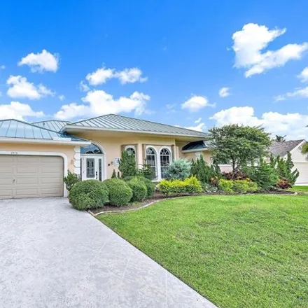 Rent this 3 bed house on 1975 Lynton Cir in Wellington, Florida