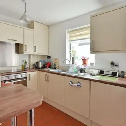 Rent this 2 bed townhouse on Strachan Place in London, SW19 4RH