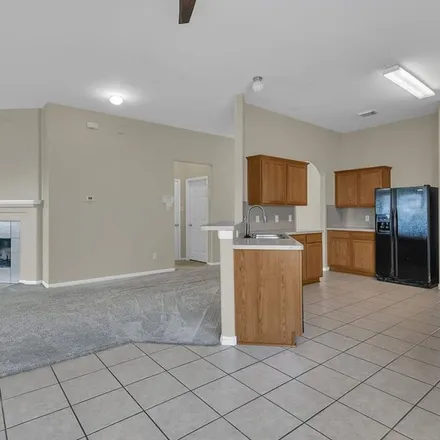 Rent this 3 bed apartment on 6586 Bella Noche Drive in Harris County, TX 77379