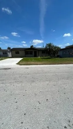 Buy this 3 bed house on 639 Southwest 7th Street in Belle Glade, FL 33430
