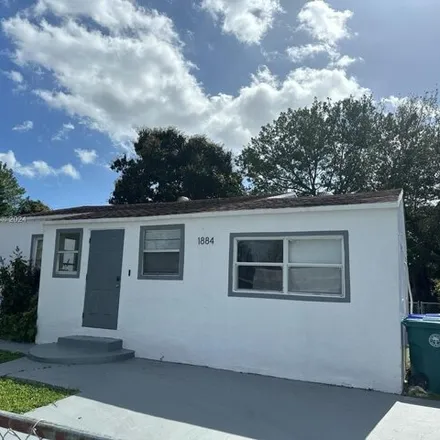 Rent this 4 bed house on 1884 Northwest 52nd Street in Brownsville, Miami