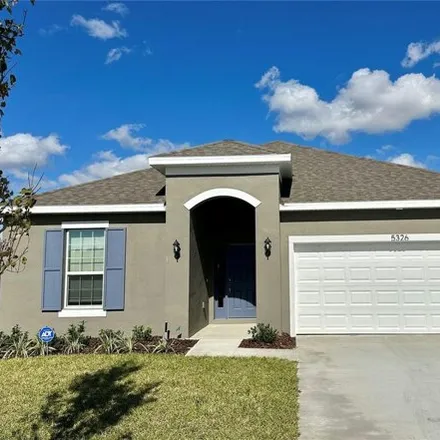 Rent this 4 bed house on Maddie Drive in Haines City, FL