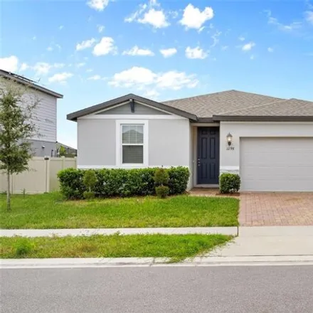 Rent this 3 bed house on Citrus Landings Boulevard in Davenport, Polk County