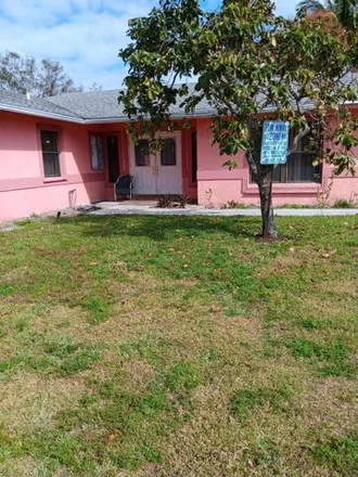 Buy this 4 bed house on 1303 North Mangonia Drive in Palm Beach Lakes, West Palm Beach