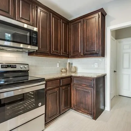 Rent this 3 bed apartment on 9401 Abbey Road in Irving, TX 75063