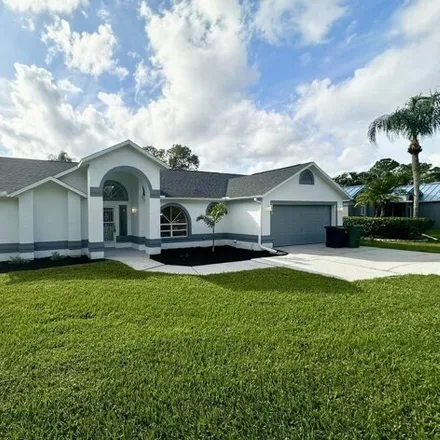 Buy this 4 bed house on 7722 Greenboro Drive in West Melbourne, FL 32904