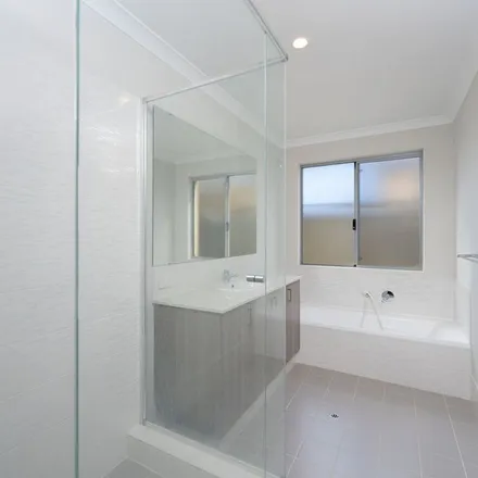 Rent this 4 bed apartment on Lancaster Loop in Piara Waters WA, Australia