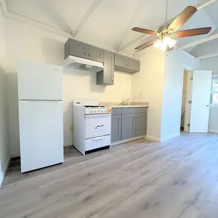 Rent this 4 bed apartment on 1097 South Norton Avenue in Los Angeles, CA 90019