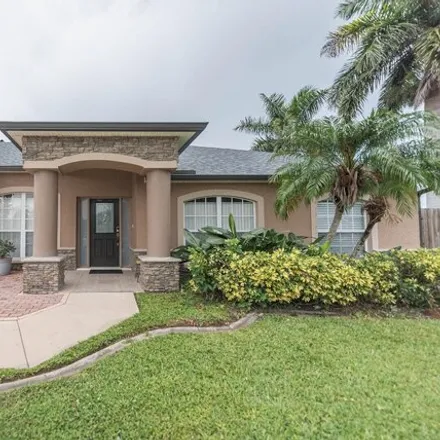 Buy this 4 bed house on Dell Drive in Melbourne, FL 32935
