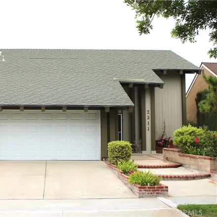 Rent this 4 bed house on 2311 Basswood Circle in Tustin, CA 92780