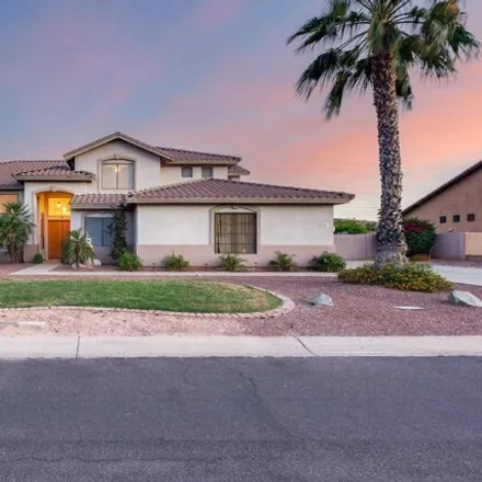 Buy this 5 bed house on 5501 West Whispering Wind Drive in Glendale, AZ 85310