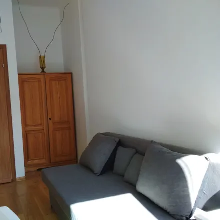Rent this 3 bed room on Marszałkowska 20/22 in 00-590 Warsaw, Poland