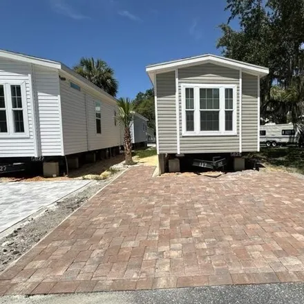 Buy this studio apartment on 11240 N Northwood Dr in Inglis, Florida