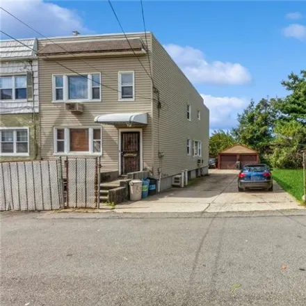 Buy this 5 bed house on 57-52 75th Street in New York, NY 11379