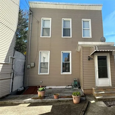 Buy this 3 bed house on 59-24 Palmetto Street in New York, NY 11385