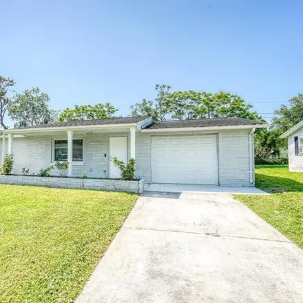 Buy this 3 bed house on 5044 Cape Cod Drive in Elfers, FL 34690
