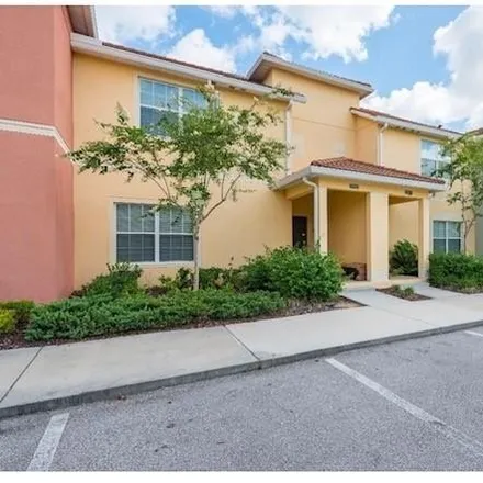Rent this 4 bed townhouse on 8955 Bismarck Palm Rd in Kissimmee, Florida